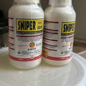 White Accessory Bottle with Red and Yellow Label